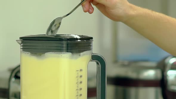 Cook Adds Flour To the Mixer Where Eggs Are Beaten