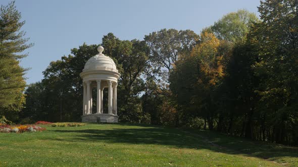 Public park hill with gazebo 3840X2160 UltraHD tilting   footage - Early autumn in Romanian city of 