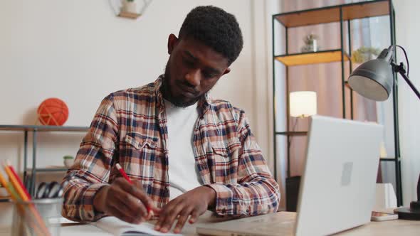 Young Man Guy Using Laptop Computer Sitting at Table Working Online Shopping From Home Office