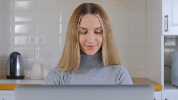 Happy entrepreneur business woman working on laptop computer with cheerful smile in 4k video