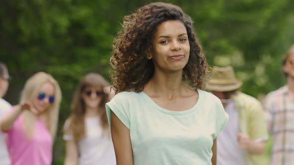 Beautiful Biracial Woman Dancing, Looking Into Camera, Enjoying Party Outdoors