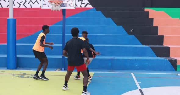 Multiracial friends playing basketball outdoor - Urban lifestyle concept