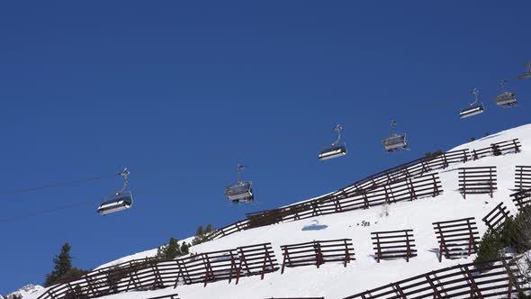 Ski Lift Moving Over Snowy Landscape in Austrian Alps