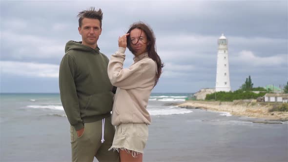 Family of Two Walk To the Lighthouse