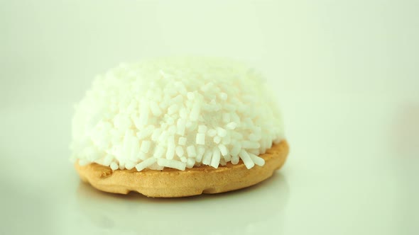 Cake with Coconut Crumbs on a White Background