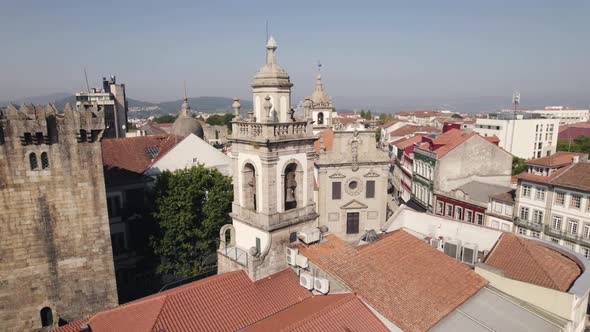 Orbital shot of a church bell tower in Braga Portugal during the day