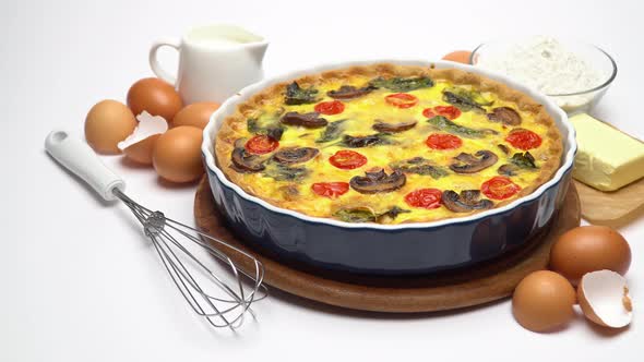 Baked Homemade Quiche Pie in Ceramic Baking Form, Eggs and Cream