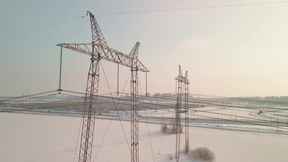 Power Pylons in a Field in Winter