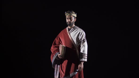 Roman Emperor. Historical reenactment. Black background.