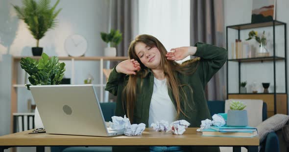 Female Worker Raising Her Head from the Table Falls Asleep Working on Start Up Proejct at Home