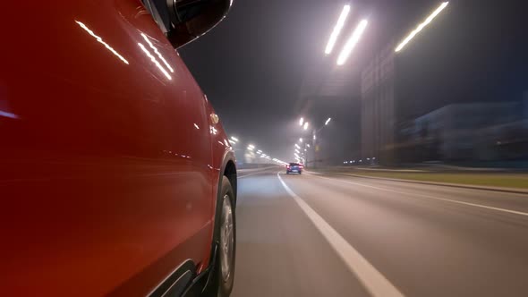 Drivelapse Urban Look From Fast Driving Car at a Night Avenue in a City Timelapse Hyperlapse