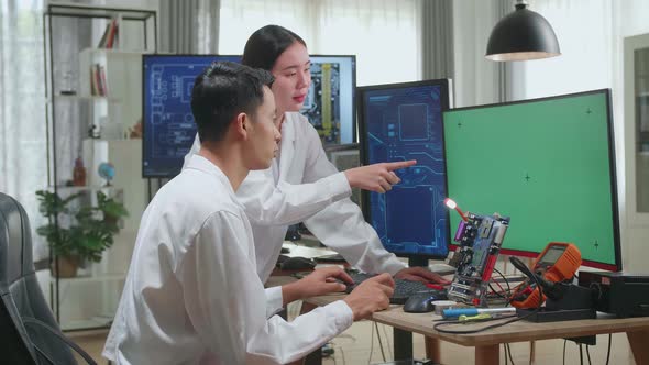 Engineer Project Manager Talks With Scientist Working On Green Chroma Key Screen Computer