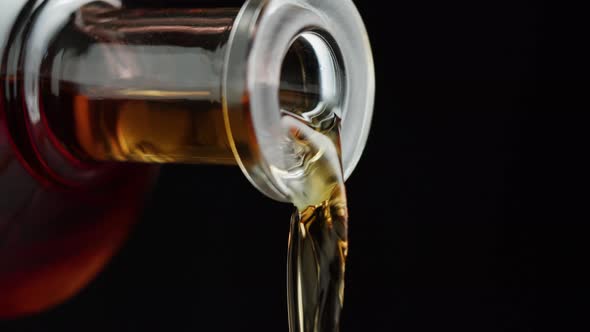 Pouring Brandy or Whiskey Closeup