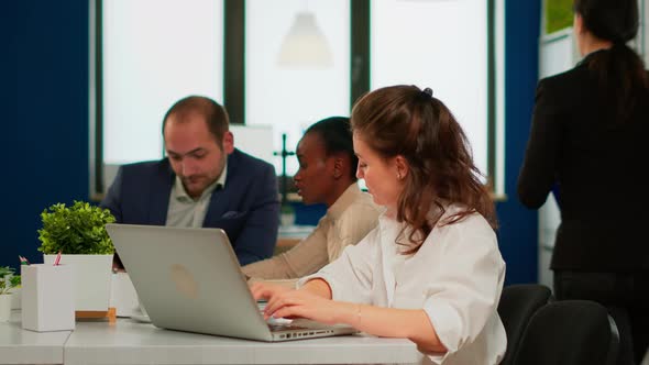 Satisfied Business Woman Answering Emails Typing on Laptop