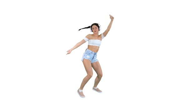 Caucasian female model in headphones jumping expressing