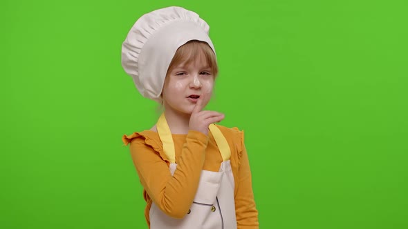 Child Girl Kid Dressed As Cook Chef Holding Finger on Her Lips on Chroma Key Gesture Hush Secret