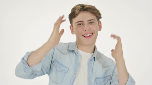 Young Man Dancing in Joy on White Background