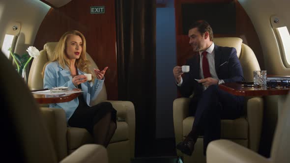 Business Team Drink Coffee on First Class Flight