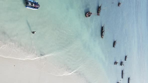 Tanzania Vertical Video  Boat Boats in the Ocean Near the Coast of Zanzibar Aerial View