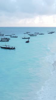 Vertical Video Boats in the Ocean Near the Coast of Zanzibar Tanzania