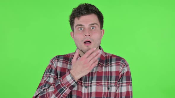 Portrait of Young Man Feeling Shocked Green Chroma Screen