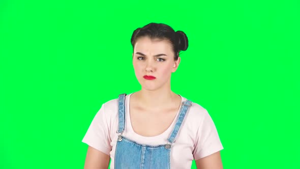 Girl Listens with Approval and Shows a Like Sign on Green Screen, Slow Motion