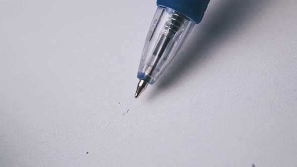 Clicking Pen Above White Empty Paper Extreme Close View