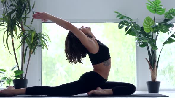 Young Woman Doing Yoga Workout At Home