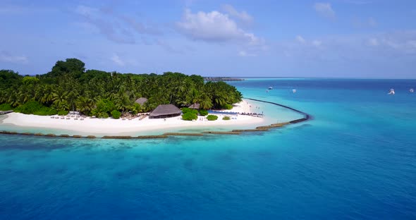 Tropical aerial abstract view of a sunshine white sandy paradise beach and aqua blue ocean background