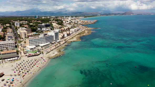 Aerial drone footage of the beach front on the Spanish island of Majorca Mallorca, Spain