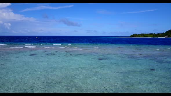 Aerial top down sky of idyllic island beach holiday by aqua blue sea with white sand background of a