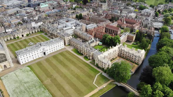 Reverse aerial shot of Cambridge as the camera is panning up revealing more of the city skyline