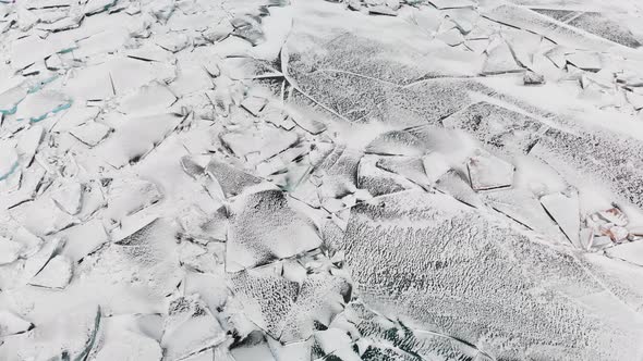 Aerial View Ice Hummock and Cracks at Frozen Lake