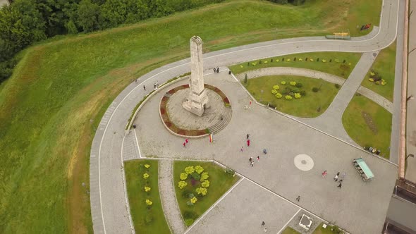 Aerial Panning shot around monument in Citadel Alba-Carolina, Alba-Iulia, Romania with walls and fla