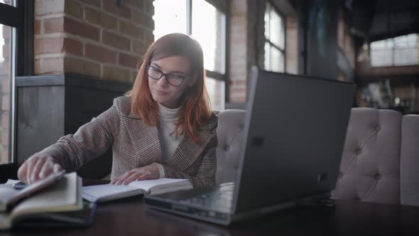 Business Coach in Glasses for Vision Conducts Online Training Remotely Communicating with Students