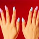 Woman's Hands with Beautiful Nails on Red Background - VideoHive Item for Sale
