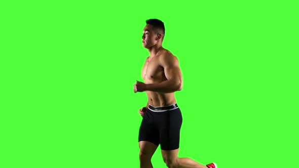 Man Running on Green Screen Background, Slow Motion. Side View