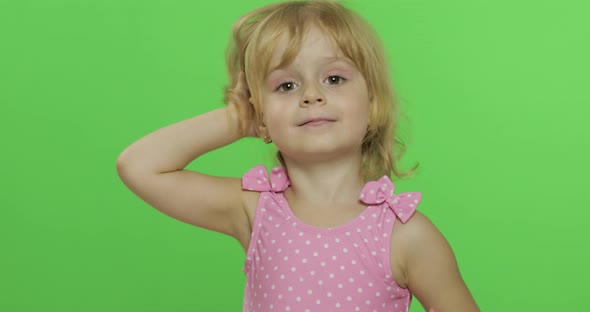 Pretty Child Emotionally Makes Faces and Smile in Pink Swimsuit. Chroma Key