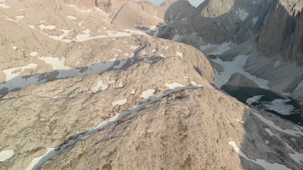 Drone Flying High Over Valley of Alpine Lake Antermoia in Dolomites Italy