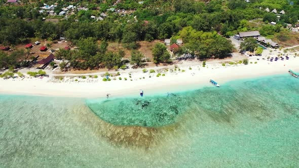 Aerial top view panorama of relaxing seashore beach journey by turquoise ocean with white sand backg