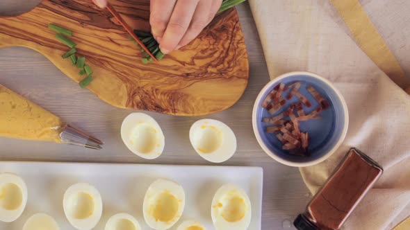 Preparing deviled eggs with organic eggs for appetizer. Step by step recipe.