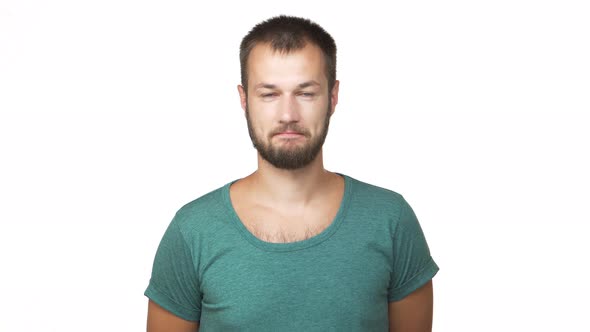 Portrait of Caucasian Adult Guy with Short Dark Hair Nodding in Agreement Looking on Camera Being