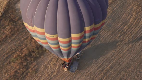 Tourists at Hot Air Balloon Envelope with Coloured Stripes