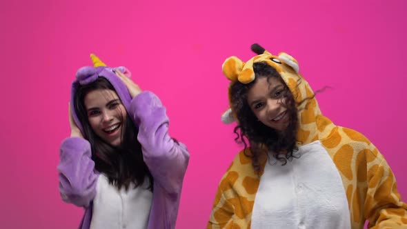 Women in Funny Animals Jumpsuits Dancing and Having Fun on Pajamas Party Slow Mo