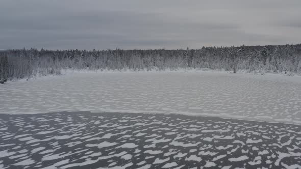 Layers of ice across Moosehead Lake fresh dusting of snow in wilderness