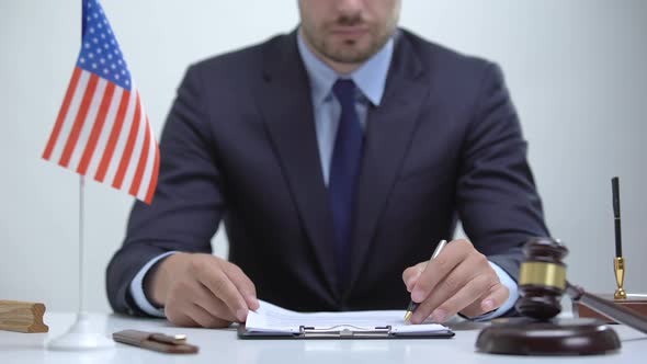 American Attorney Inspecting Documentary Evidence, Making Winning Case Strategy