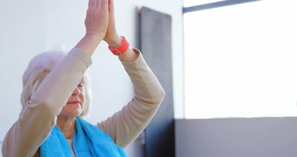 Senior woman performing yoga 4k