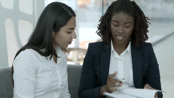 Businesswomen Working with Papers