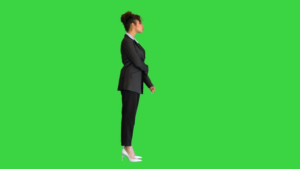 Young African American Woman Posing for the Camera on a Green Screen Chroma Key