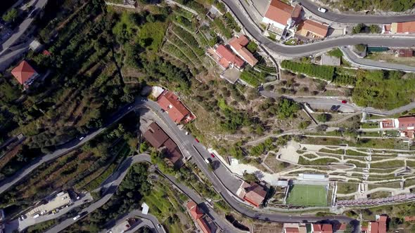 Italian Amalfi coastline terraces with roads in the town of San Michele seen from above, Aerial top